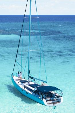 A sailboat drops anchor in the Caribbean Sea