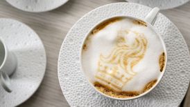 Latte with custom Ritz-Carlton foam logo
