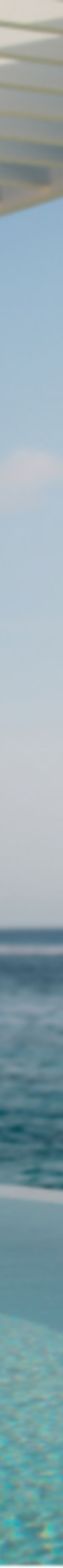 An infinity pool blends into the ocean horizon