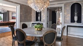 A suite dining room with crystal chandelier, seven