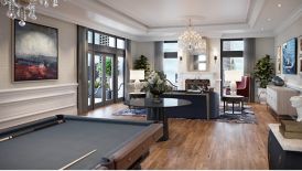 suite living area with pool table and fireplace