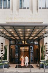 A couple enters The Ritz-Carlton, Berlin