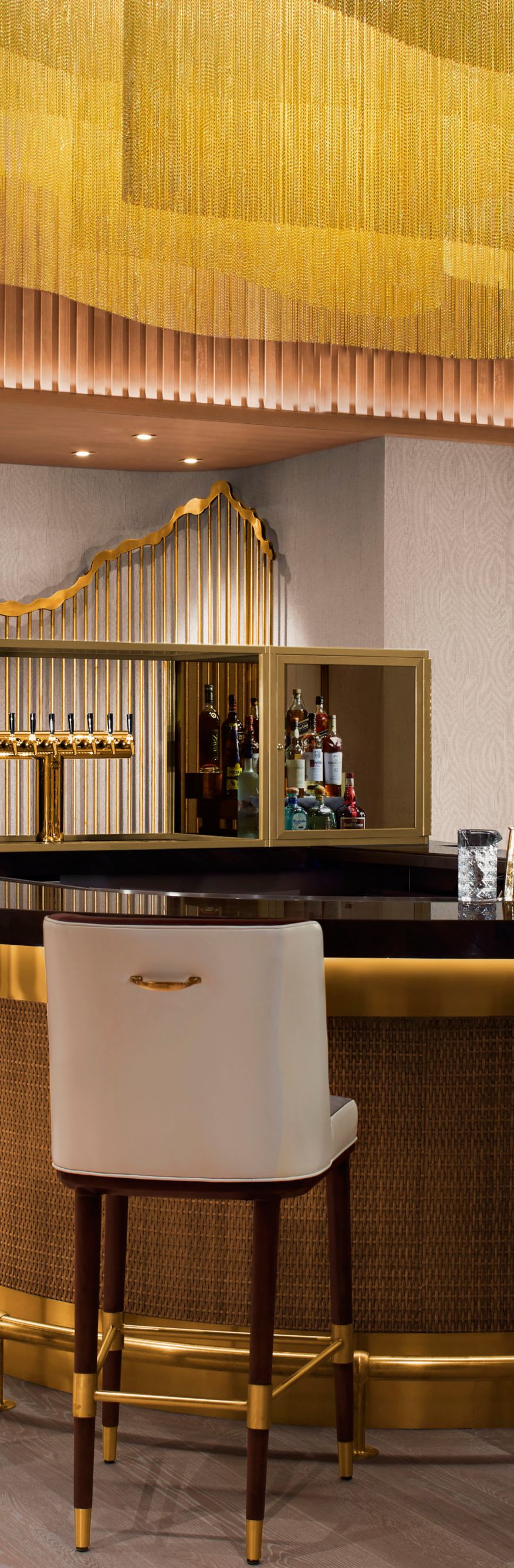 U-shaped bar with chairs around it 