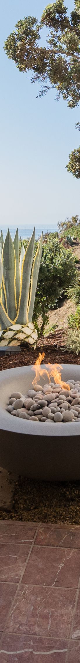 Seating around firepit with water views. 