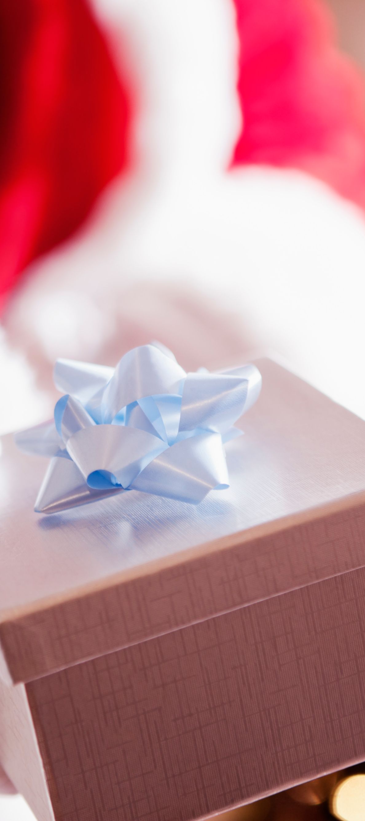 Santa with gift and blue bow