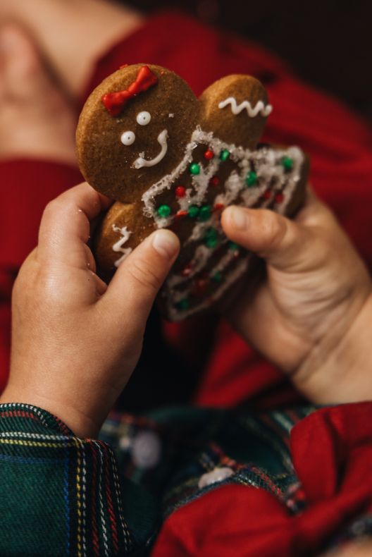 Baby holding gingerbread man