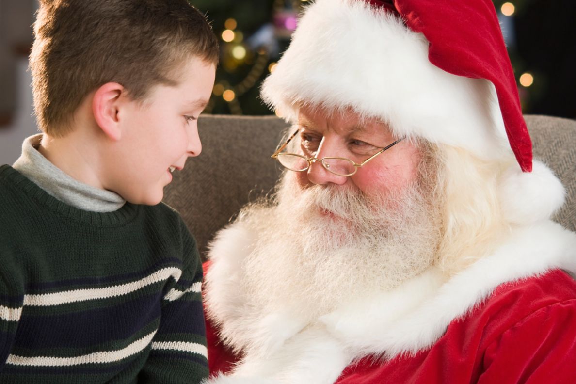 Boy sitting on Santa Claus's lap