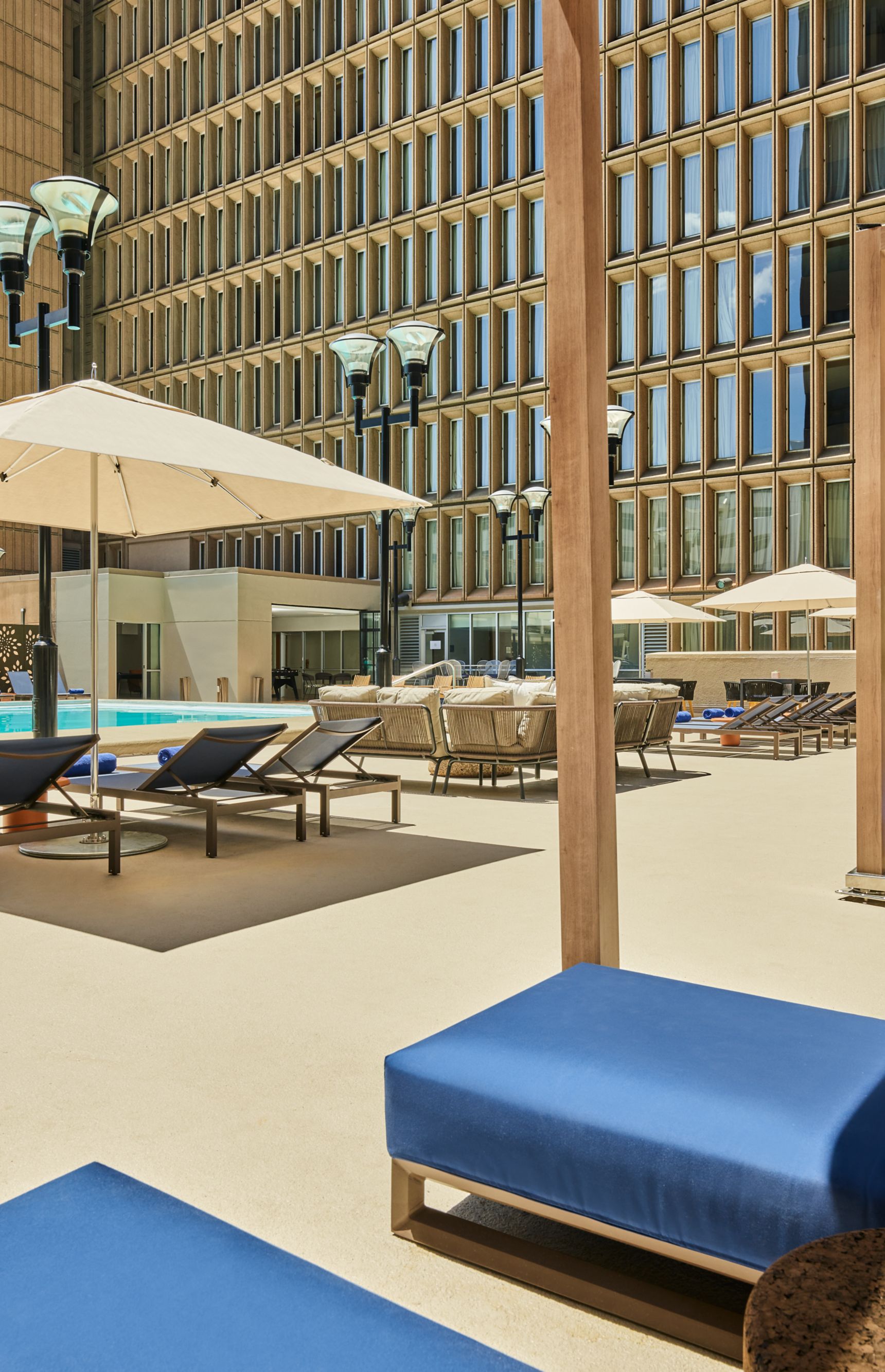 Outdoor pool with lounging areas.