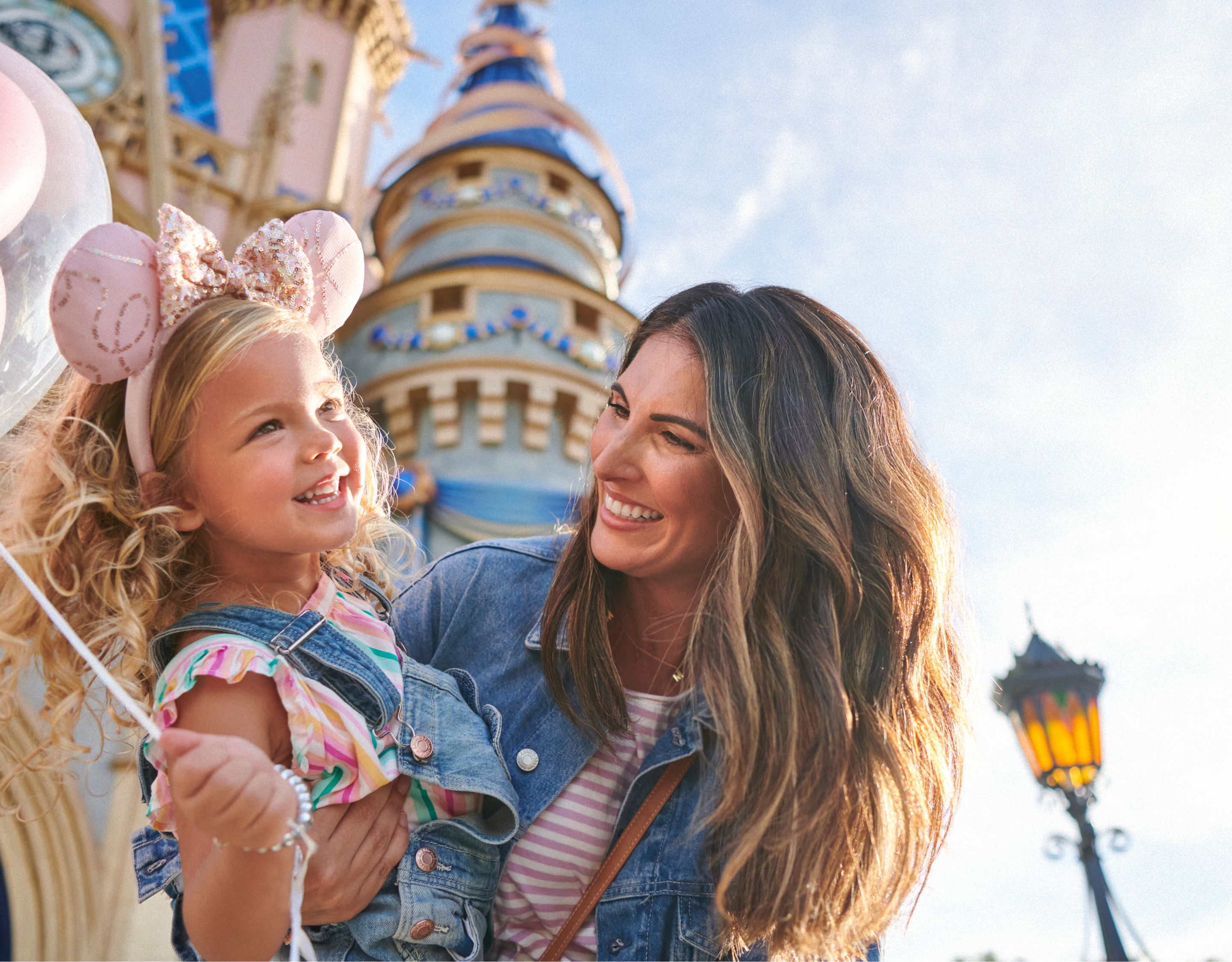 woman and child in front of cinderellas castle