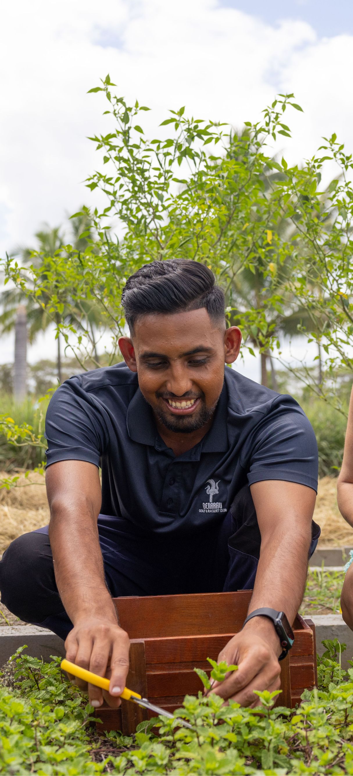 Three friends working in a garden