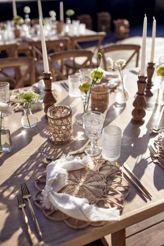 Place settings on outdoor dining table. 