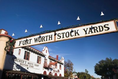 A banner over a street that reads Fort Worth Stock Yards