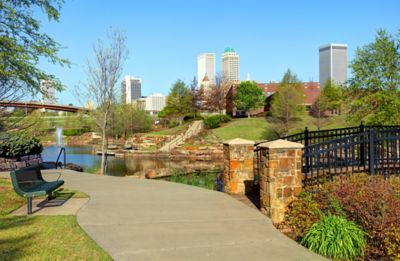 City skyline with landscaped water feature in foreground