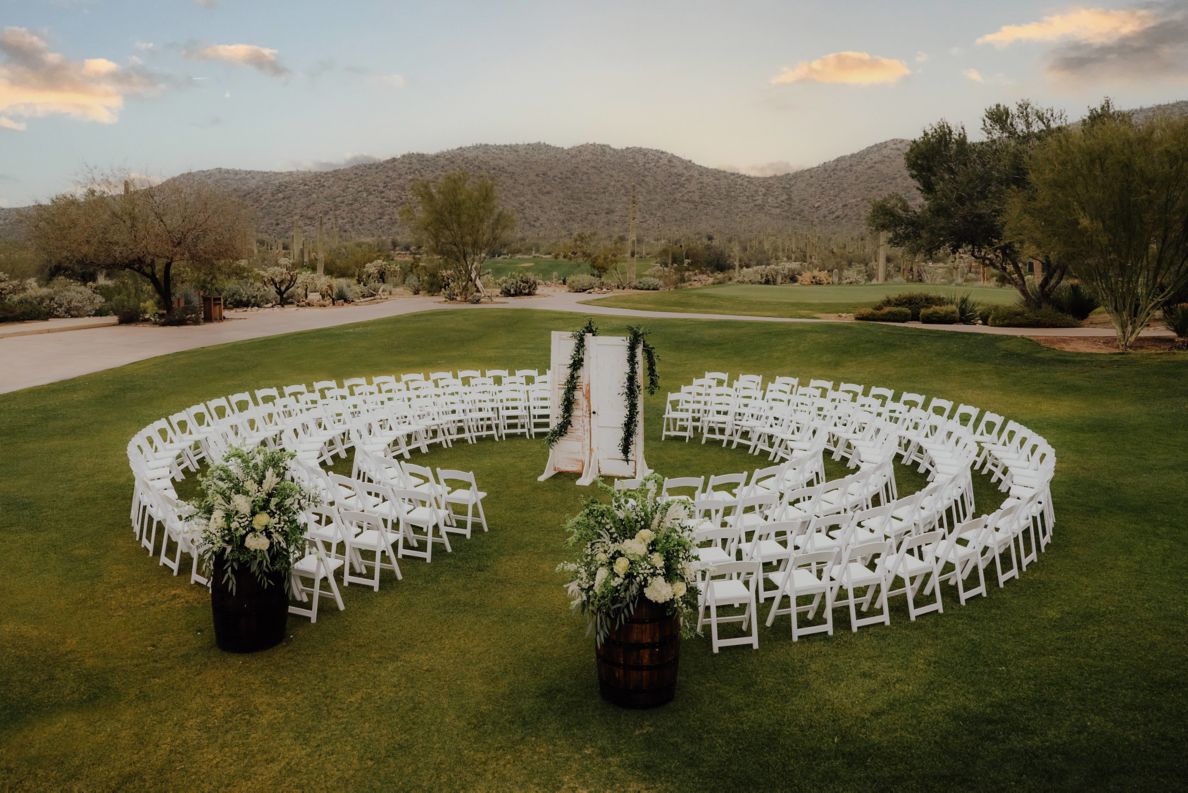 Aerial view of the Sunset Wedding Ceremony with the chairs aligned in a circle with doors in the center.