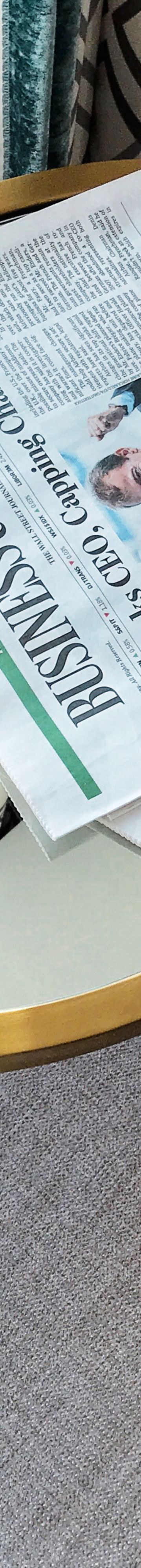 Women sitting at Coffee shot looking at Computer