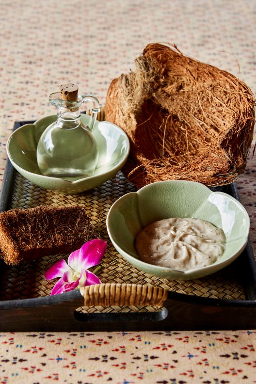 Coconut and other products used in a spa treatment.