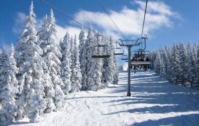 A ski lift on a snowy mountain in winter
