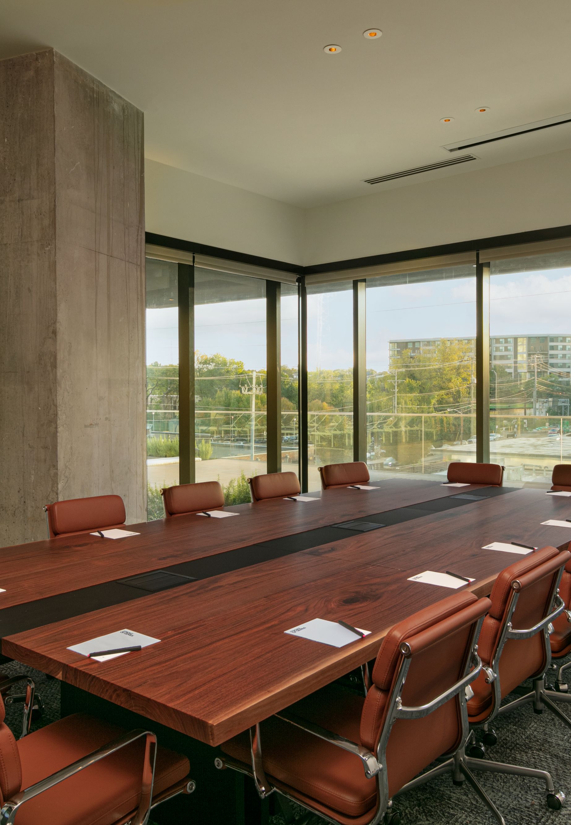 Conference table with floor to ceiling windows. 