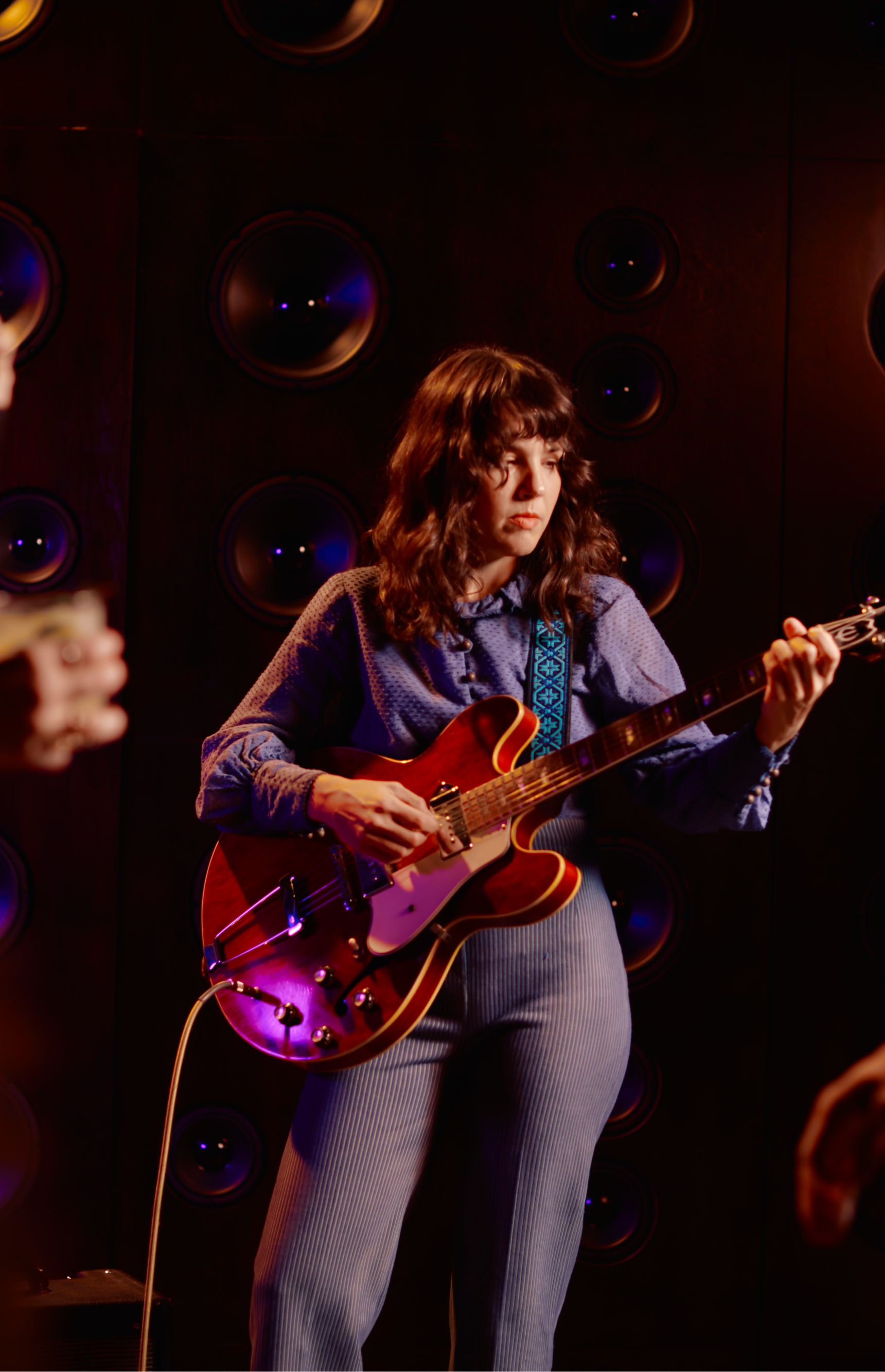 Woman playing a guitar. 