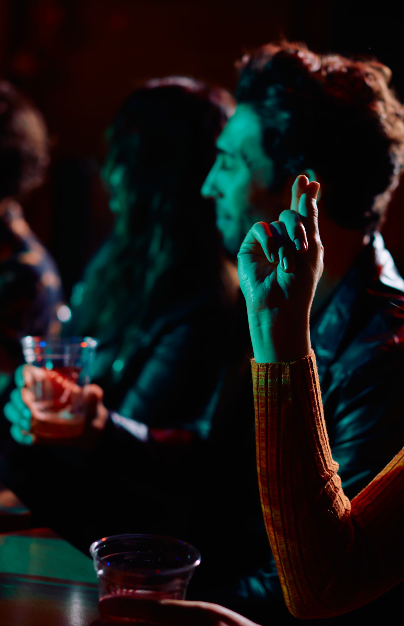 Group sitting at table with beer. 
