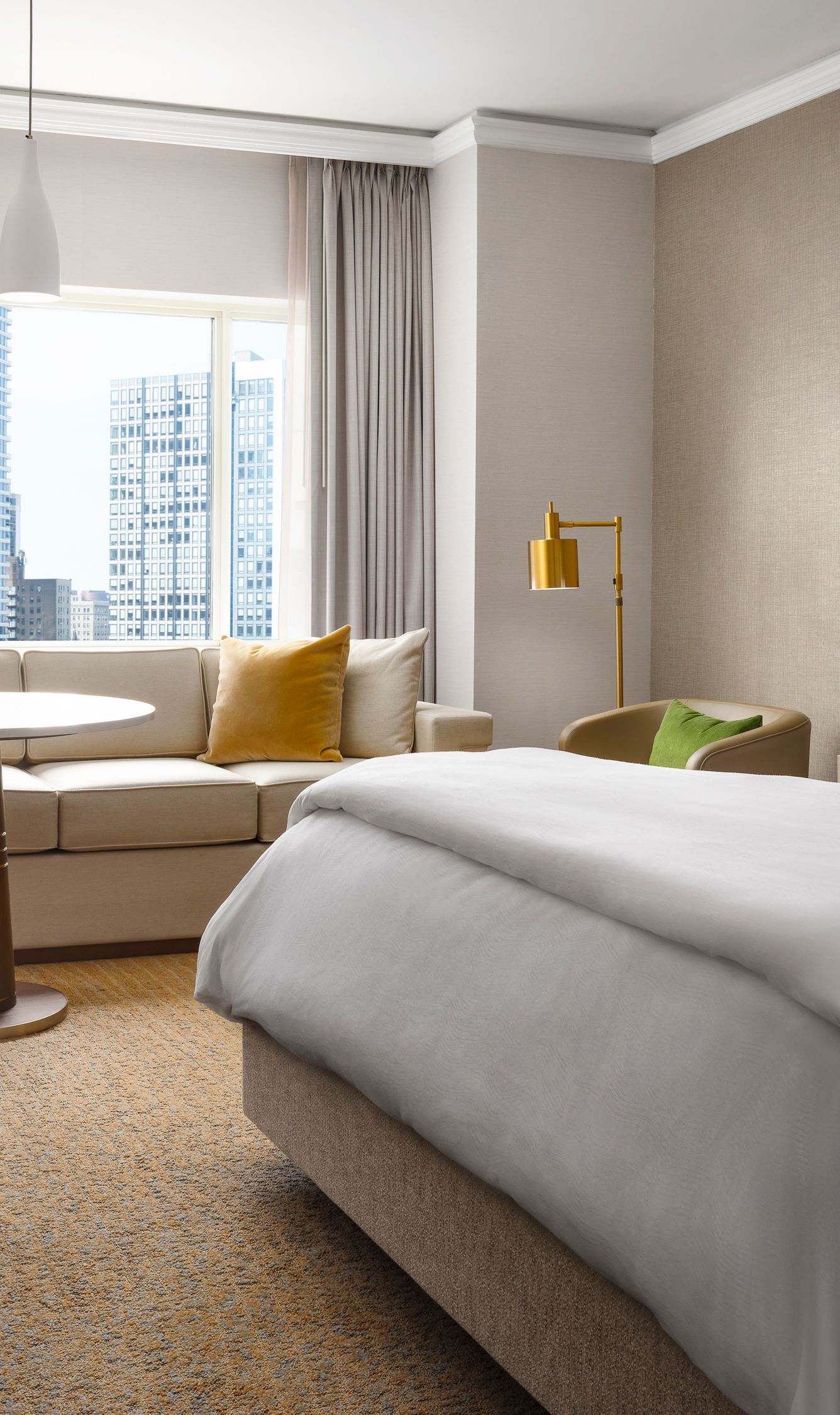 King guest room with sofa and view