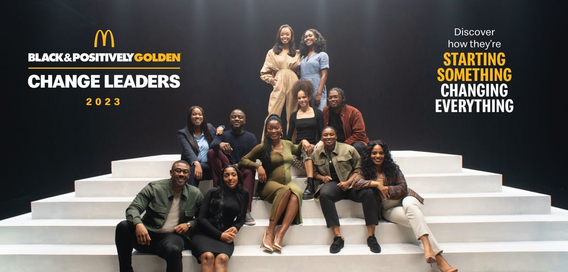 Black & Positively Golden 2023 Change Leaders sitting on stairs 