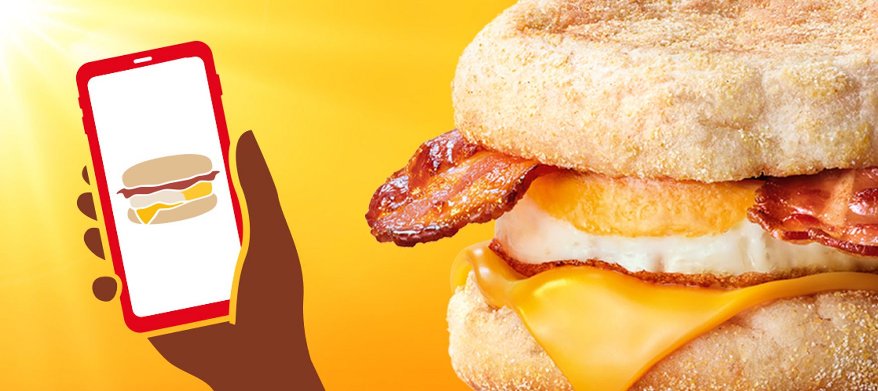 Das Bild zeigt die Illustration eines Smartphones mit der myMcDonald’s App und einen McMuffin® Bacon & Egg.