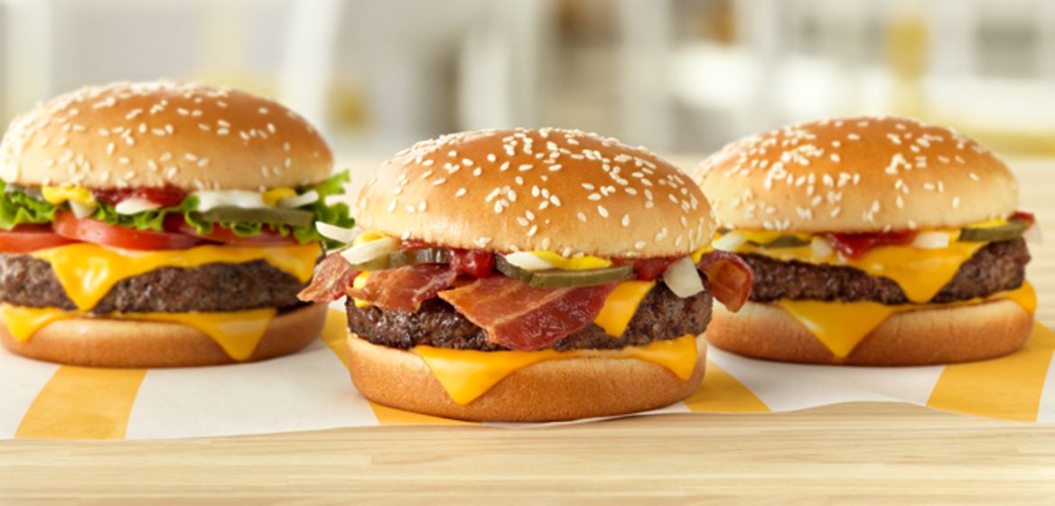 Left to right: Quarter Pounder Deluxe, Quarter Pounder with Cheese Bacon, and Quarter Pounder with Cheese, Fresh Beef Burgers. 