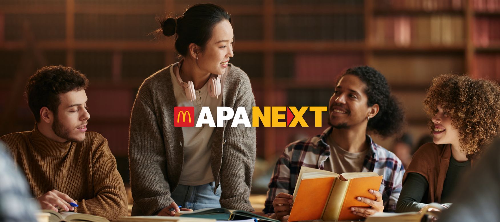 Four college students with diverse portraits and the APA Next logo