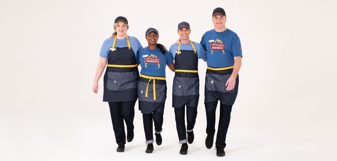 Crew members wearing new sustainable uniforms 