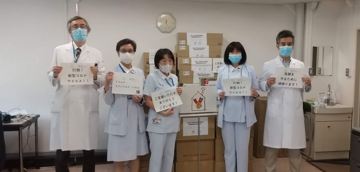 Nurses in masks with signs