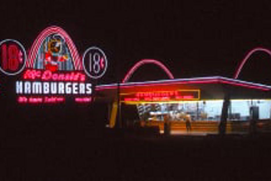 Vintage McDonald's restaurant and neon road sign