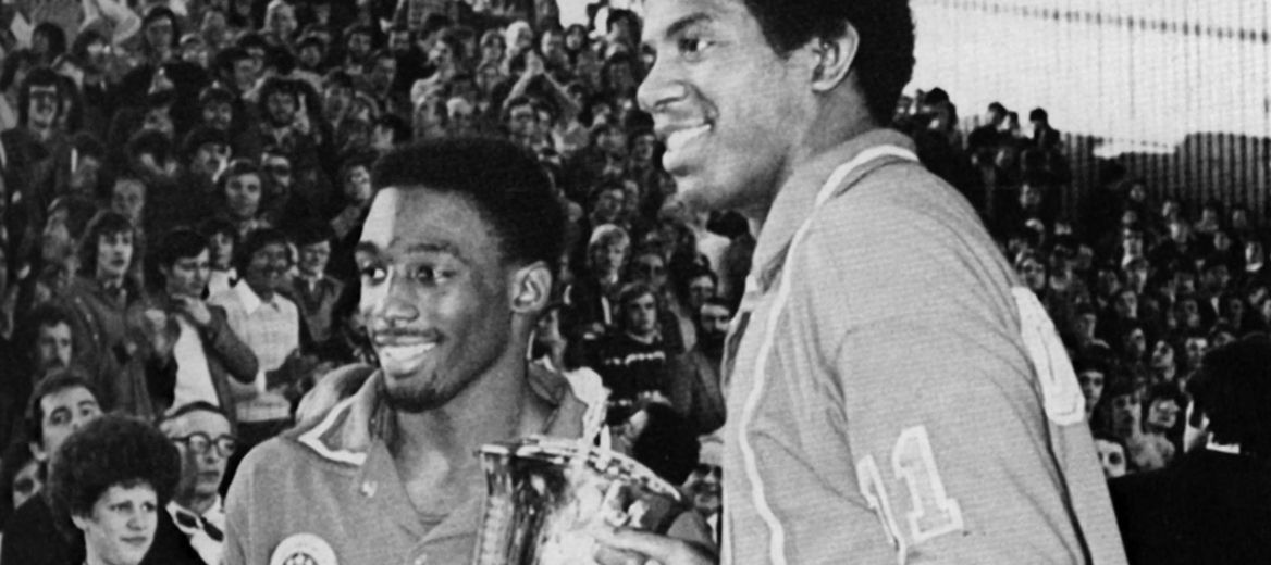 U.S. All-Star teammates Albert King and Magic Johnson posing with the winning trophy at the 1977 Capital Classic All-Star Game