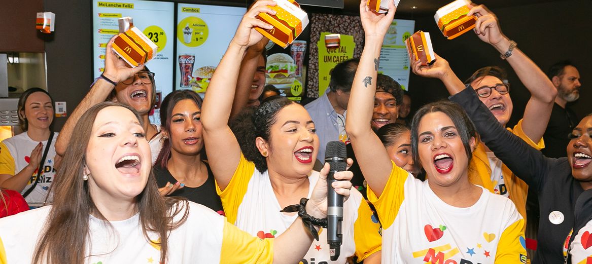 Team members excitedly celebrate McDia Fleliz at McDonald’s Brazil