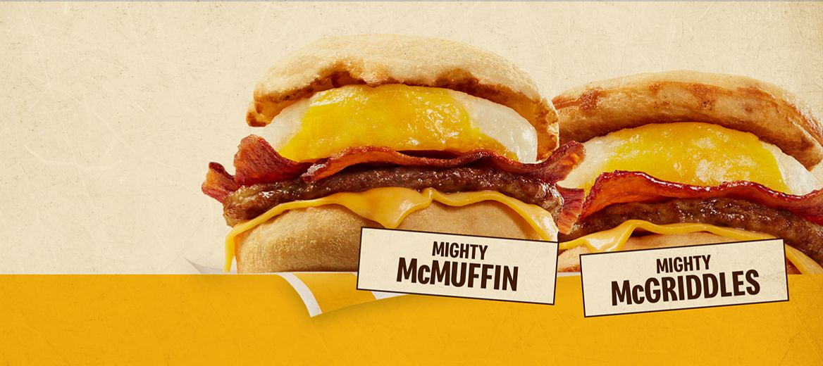 An image of two breakfast sandwiches. On the left is a Mighty McMuffin® and on the right is a Mighty McGriddles®. The below them are the labels, “Mighty McMuffin” and “Mighty McGriddles”. 