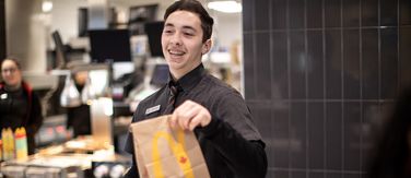 McDonald's staff serving food over the counter