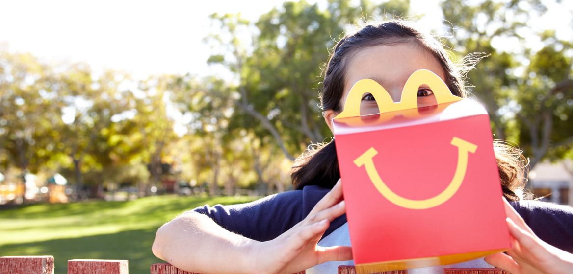 woman holding Happy Meal box