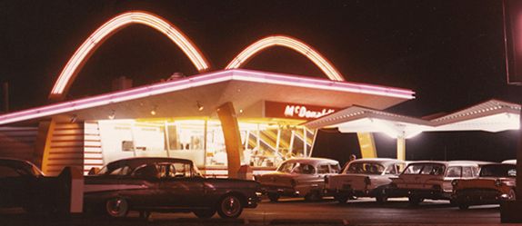 McDonald's first restaurant with multiple cars parked outside