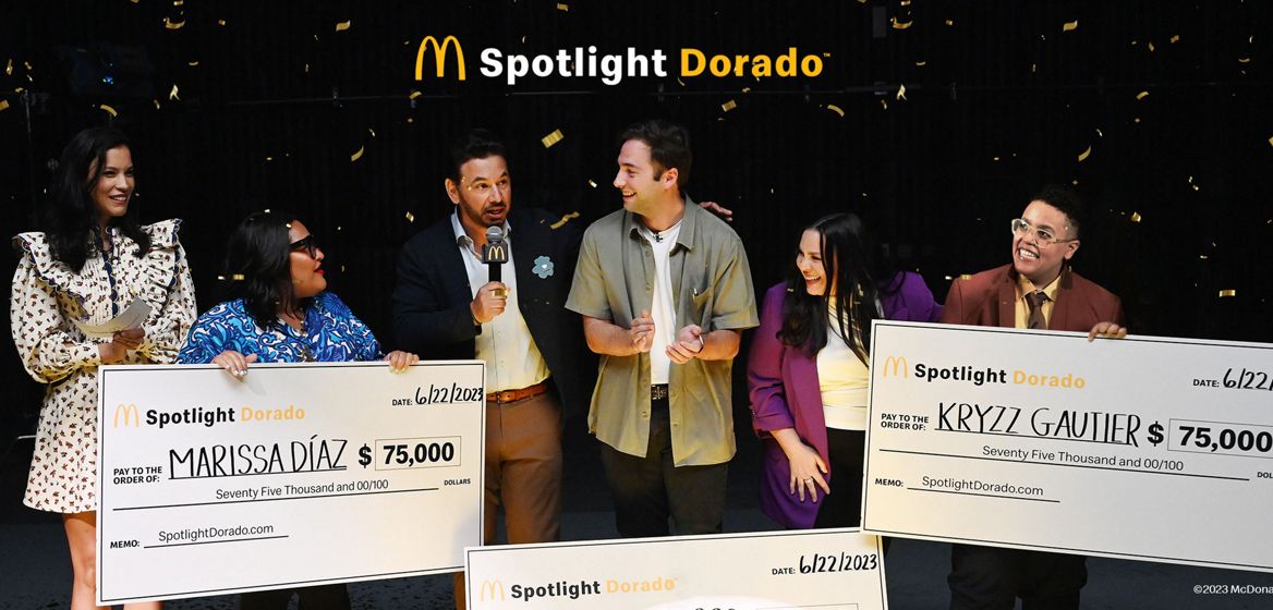 Spotlight dorados gifting a check to hispanic filmmakers 