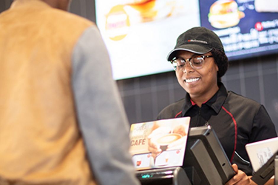Staff taking customer's order at McDonald's