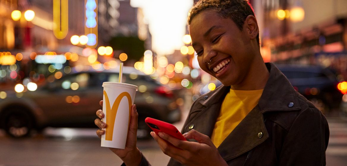 Customer with cellphone, eating McDonald's