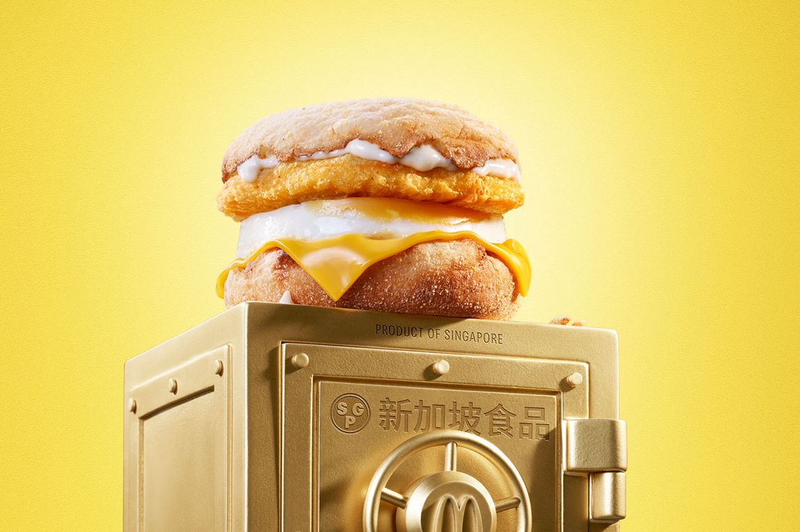McDonald’s Chicken & Egg McMuffin® sits on top of a gold vault.