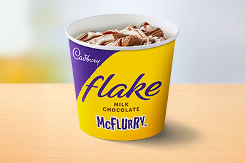 Soft dairy ice cream, swirled with pieces of Cadburys Flake with brown Milk Chocolate sauce.