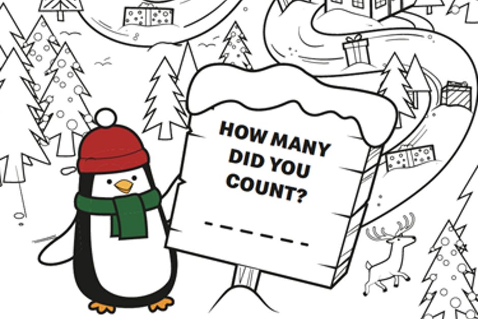 A penguin with a sign on a forest with presents.
