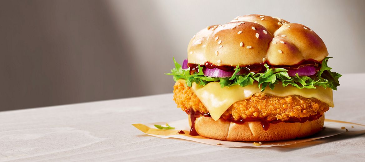 The McCrispy® BBQ Smokehouse burger on top of a grey table