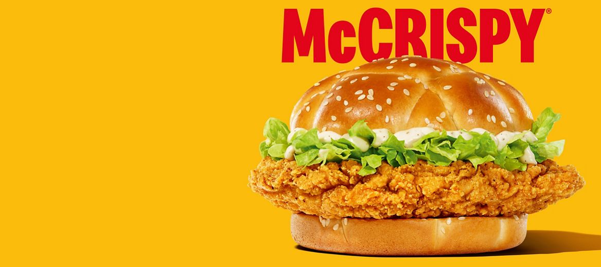 McCrispy burger on a plain yellow background with bold red font saying “McCrispy” above it.