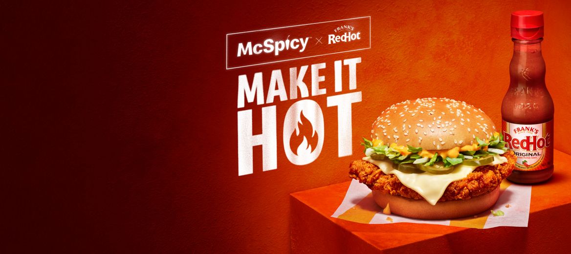 McSpicy burger next to the Frank’s RedHot® on a fiery red background
