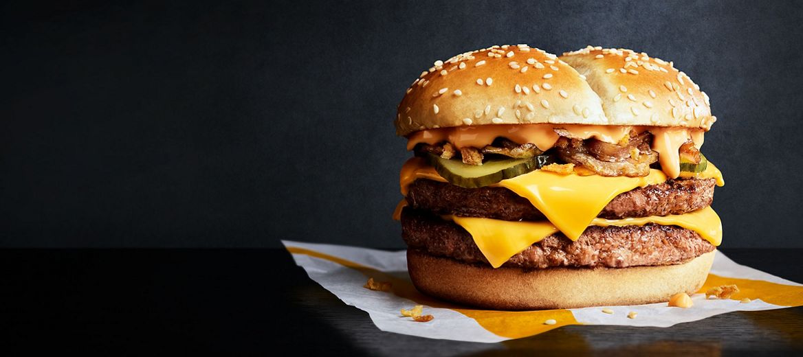 Philly Cheese Stack burger with a black background