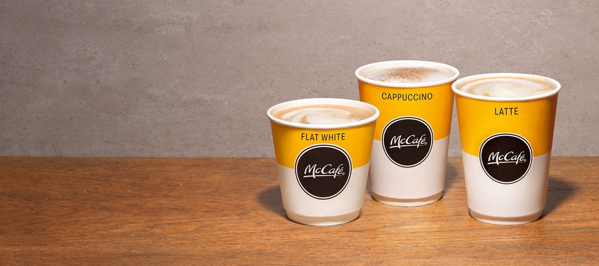 McCafé® cups on a wooden desk