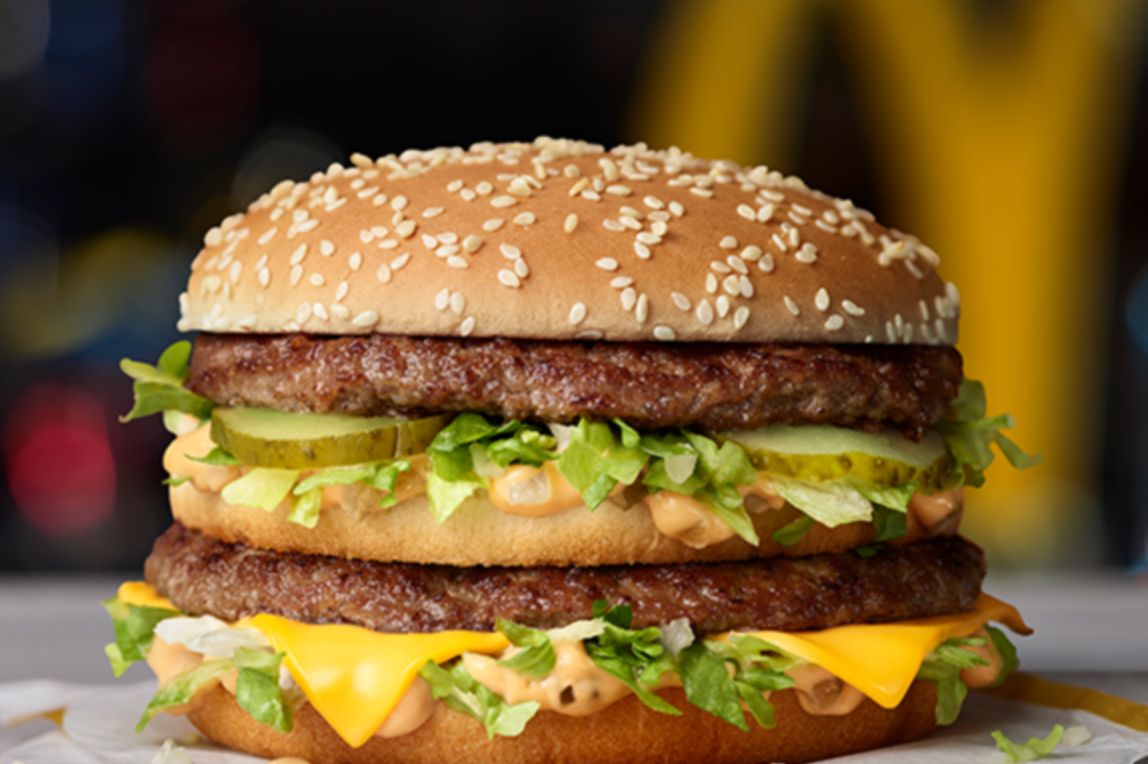 Two 100% beef patties, a slice of cheese, lettuce, onion, pickles, and Big Mac™ sauce in a sesame topped bun.